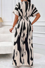 V-hals Jumpsuit Dame – Elegant Helkroppsprint med Vide Ermer